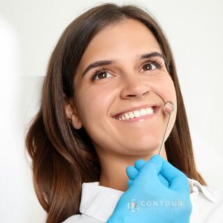 Woman showing dentist her teeth