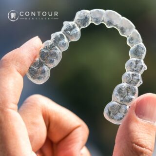 Invisalign being held up